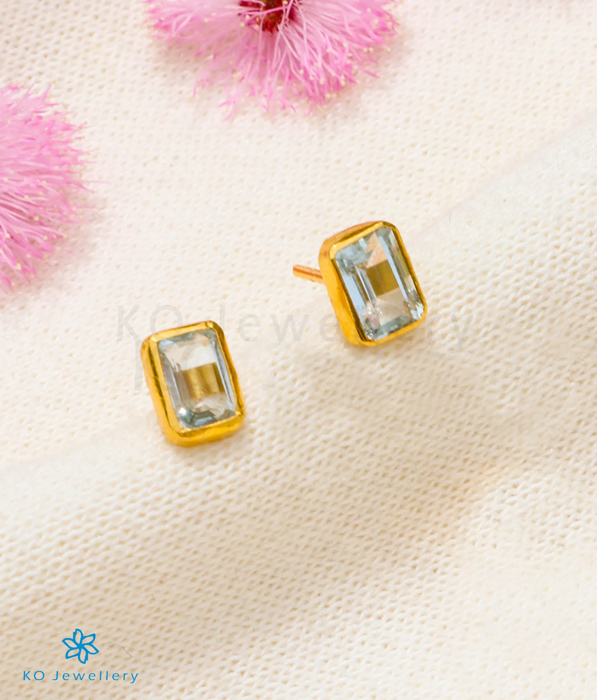 Bright Blue Topaz Earstuds in 22 KT Gold